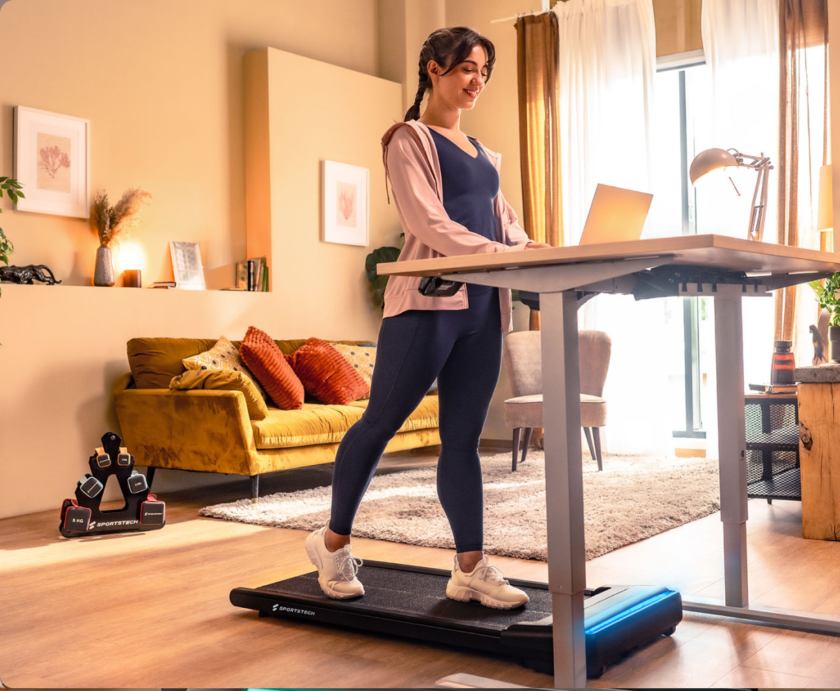 Home office with standing desk and treadmill